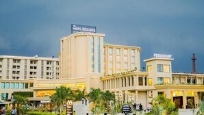 A hotel with a prominent 'Mars Resorts' sign, a 'Foodcourt' area, and a McDonald's restaurant. - Mars Resorts (Meerut)