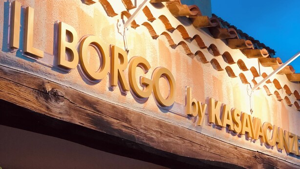 A sign with the text "IL BORGO by KASAVACANI" on a building facade. - Il Borgo Boutique rooms By Kasa Vacanze  (Loiri Porto San Paolo)