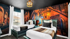 A bedroom with two beds, a chandelier, and a mural of a medieval scene. - Dream Disney Storey Lake House / private pool and 2 themed rooms 
 (Kissimmee)