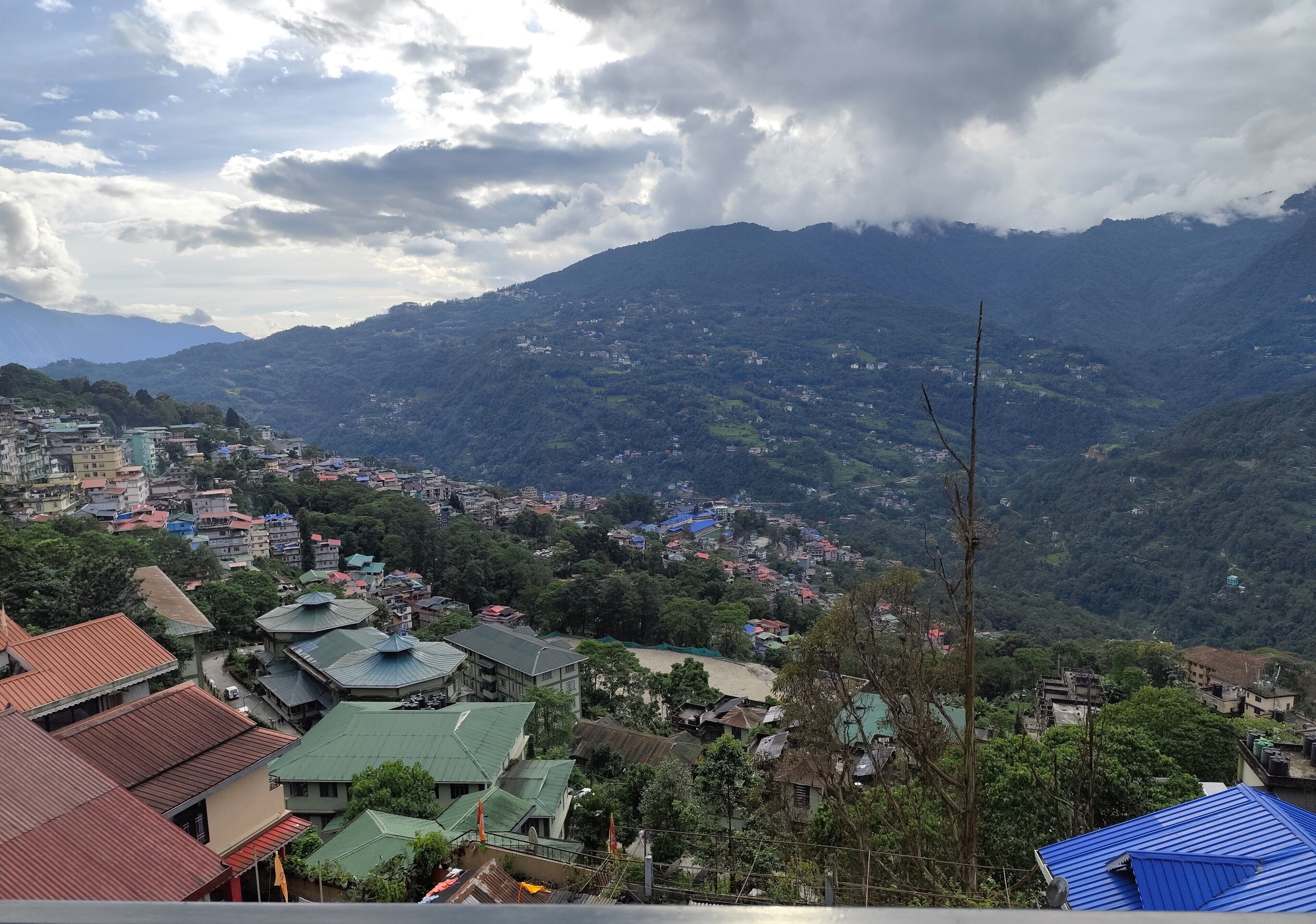 A mountainous landscape with a town nestled in the valley.