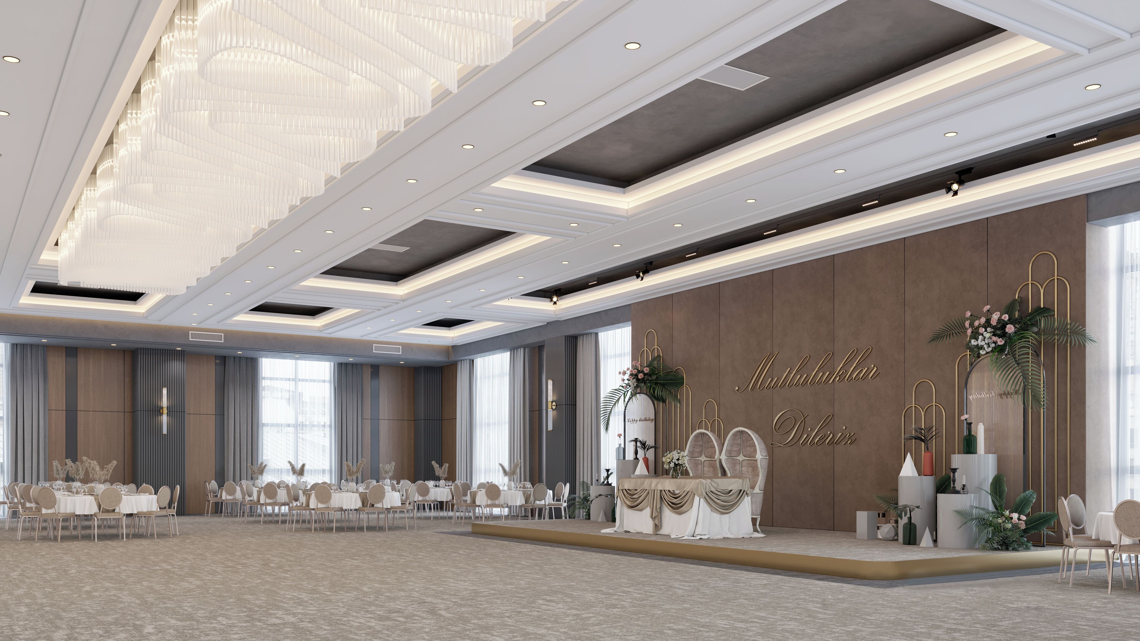 Un amplio salón de banquetes con un escenario, elegantes candelabros y un gran ventanal que proporciona luz natural.