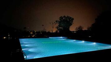 Outdoor pool, open 7:00 AM to 7:00 PM, pool umbrellas, sun loungers