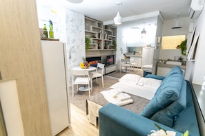 Apartment | Living area | 43-inch Smart TV with cable channels, Netflix, streaming services - Lobo (São Paulo)