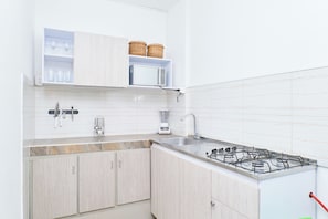 Club Apartment, Multiple Beds, Garden Area | Private kitchen | Full-size fridge, microwave, blender, cookware/dishes/utensils