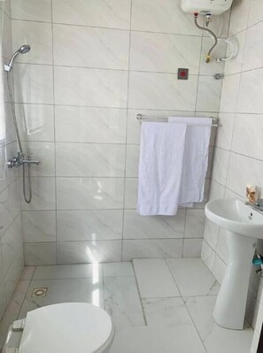 Shower, hair dryer, towels, soap
