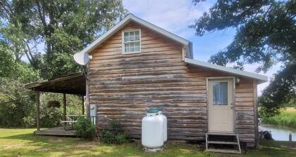 Cozy cottage that sits along canal of Sandy Pond.