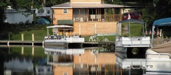 Cozy cottage that sits along canal of Sandy Pond.