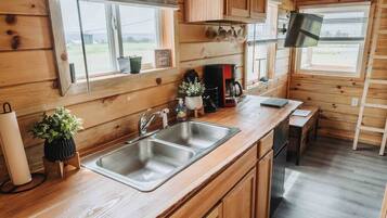 Fridge, stovetop, coffee/tea maker, cookware/dishes/utensils