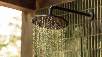 A showerhead with water flowing down.