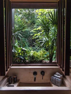 Tree House (Pool) | Bathroom | Shower, rainfall showerhead, hair dryer, bathrobes