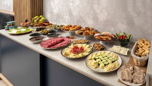 A buffet table with various food items including meats, cheeses, and vegetables. - Lenus Hagia Sophia Hotel (Istanbul)