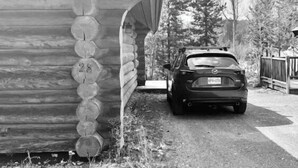 A log cabin with a car parked in front. - Dogs love our cabin in Lac Le Jeune close to lake (Logan Lake)