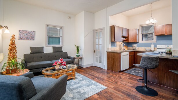 A modern apartment with a living room, kitchen, and dining area. - Historic Oregon District (Dayton)