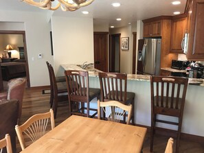 Enjoy cooking and dining in this well-equipped kitchen with a dining area and kitchen island.