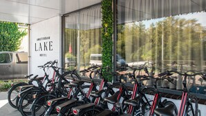 A row of bicycles parked outside a building with a sign reading "Amsterdam Lake Hotel". - Amsterdam Lake Hotel  (Badhoevedorp)