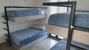 A bunk bed room with a window and a small shelf. - Vista Hermosa Glamping & Cabañas (La Mesa)