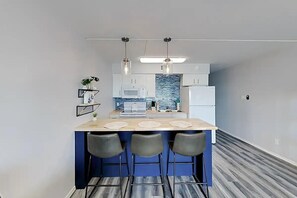 Fridge, microwave, stovetop, coffee/tea maker