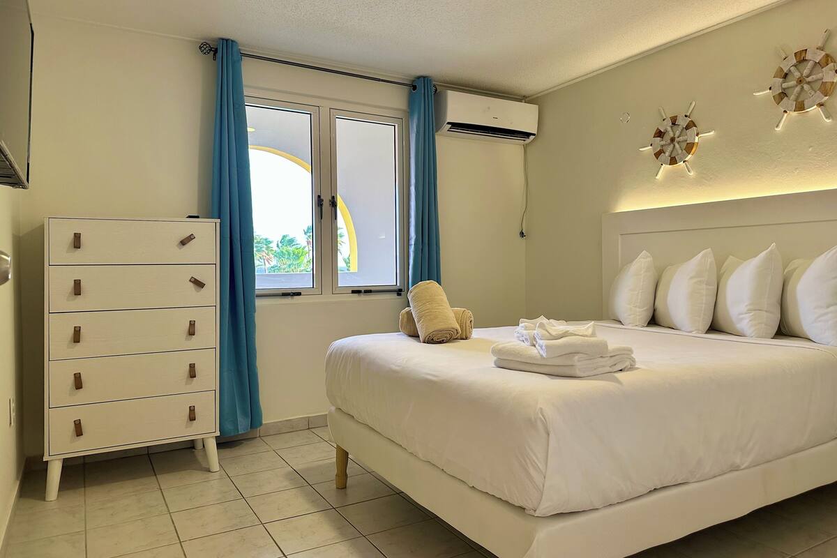 Premium bedding, memory-foam beds, in-room safe, laptop workspace