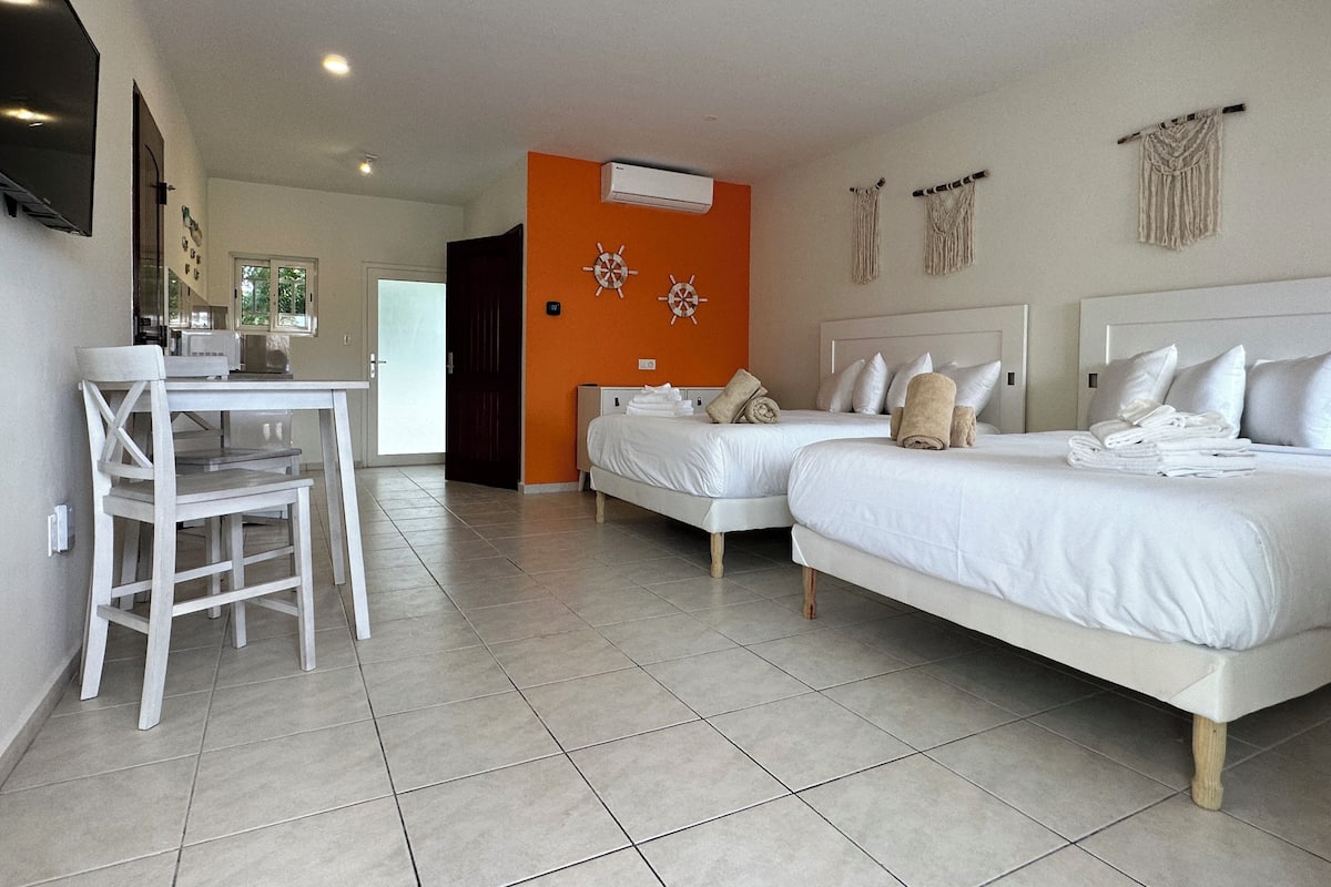 Premium bedding, memory-foam beds, in-room safe, laptop workspace