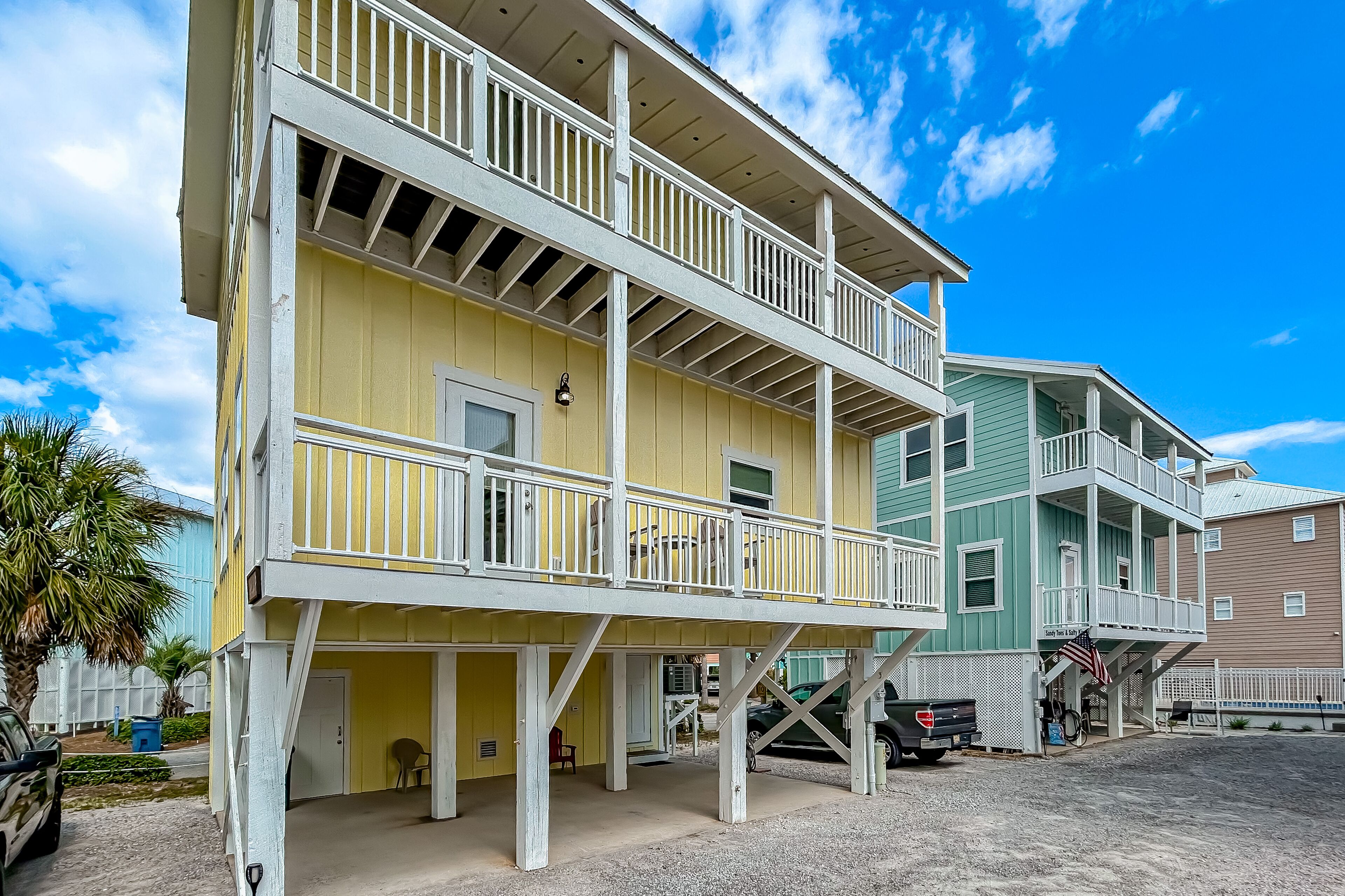 The Yellow Rose | House in Gulf Shores with balcony, shared pool, & W/D