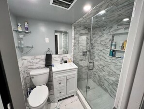 Shower, hair dryer, towels, soap