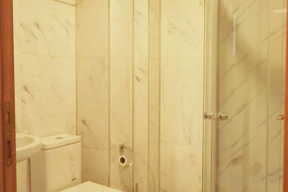 Bathroom | Shower, hair dryer, slippers, towels