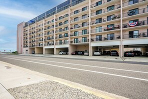 A multi-story hotel with a parking garage. - Beachfront Fourth-Floor Condo w/ Community Pool! (North Wildwood)