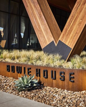 A modern building with a wooden facade and a sign that reads "BOWIE HOUSE". - Bowie House, Auberge Collection (Fort Worth)