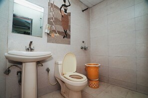 A bathroom with a toilet, sink, and a mirror. - Hotel AV International Near New Delhi Railway Station, Paharganj (New Delhi)