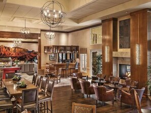 A spacious lobby with a bar area, seating arrangements, and a fireplace. - Always a Great Idea To Unwind! Close to Portalis Office Park, w/ Outdoor Pool! (Scottsdale)