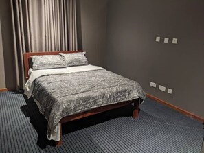 Apartment, 2 Bedrooms | 2 bedrooms, individually furnished, iron/ironing board, bed sheets - Secured Apartments (Ndola)