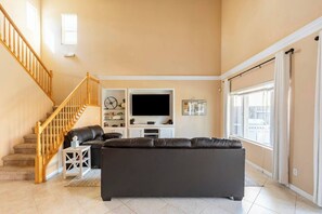 Smart TV, fireplace, books, video library