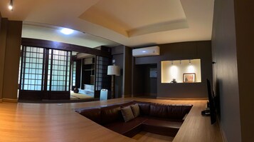 Traditional Suite | Living area | 55-inch Smart TV with digital channels