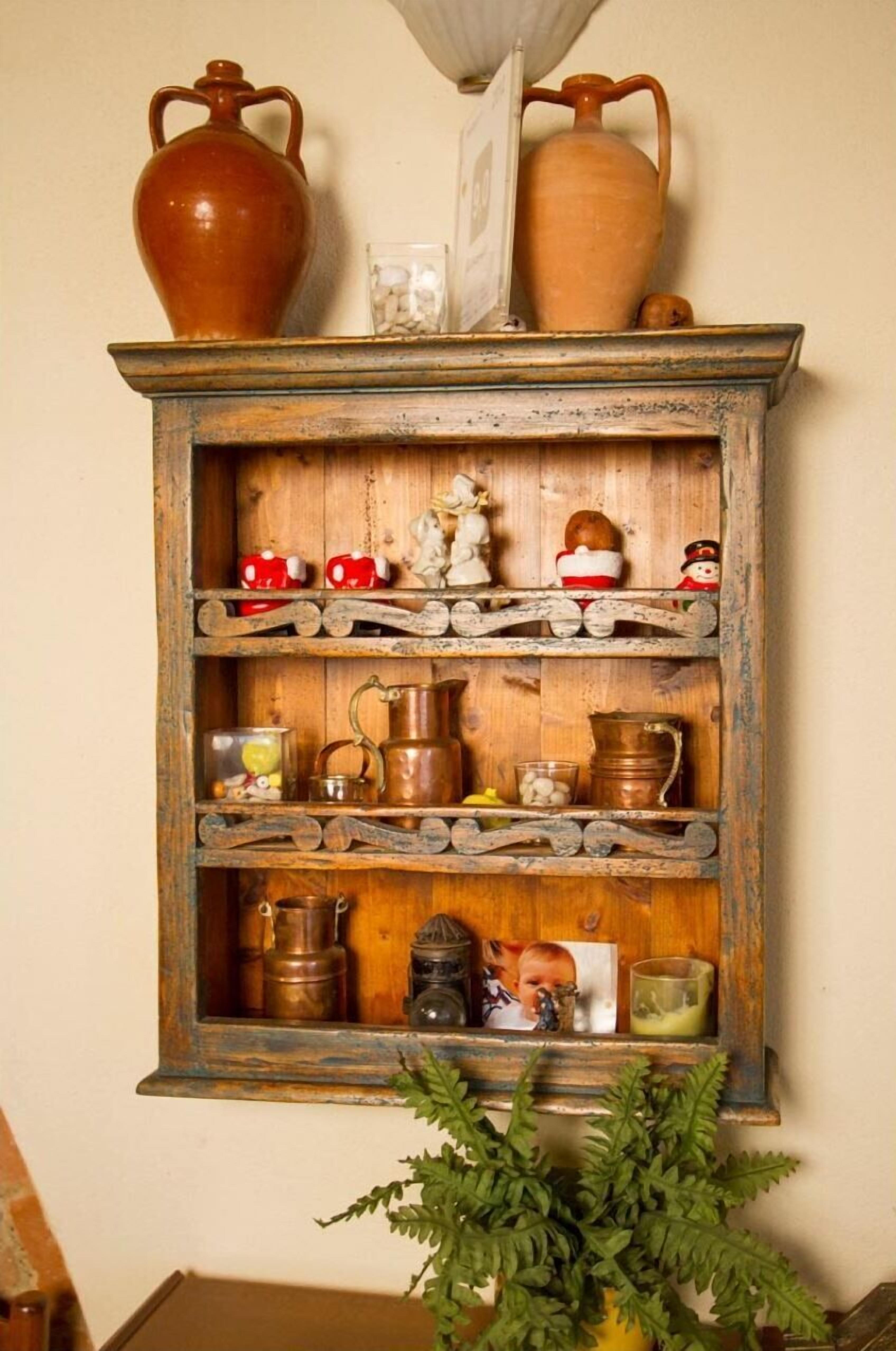 A rustic wooden shelf with various kitchen items and decorations.
