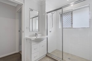 Shower, hair dryer, towels, shampoo