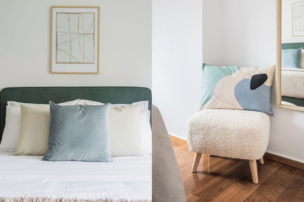 A bed with a green headboard, multiple pillows, and a fluffy rug.
