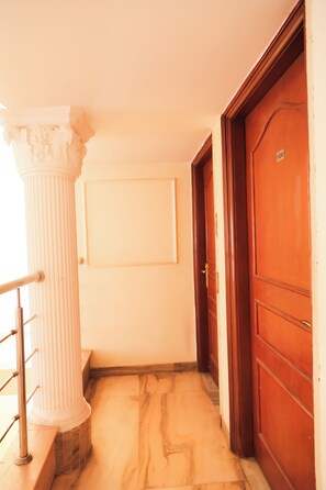 Deluxe Double Room | Balcony view - Roomshala 088 Hotel Green Villa (New Delhi)