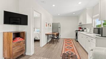 1 bedroom, desk, iron/ironing board, travel cot