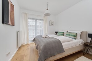 Relax in this serene bedroom with a single bed, white radiator, and floor lamp.