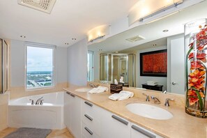 Bathtub, hair dryer, towels, soap