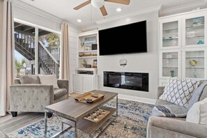 Smart TV, chimenea, futbolito y oficina