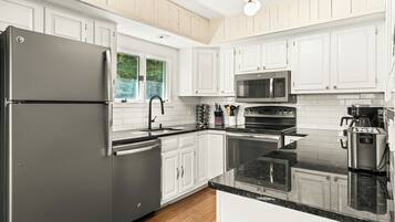 Dishwasher, electric kettle, spices, dining tables