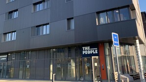A modern building with "THE PEOPLE" signage on the facade. - The People Caen (Caen)