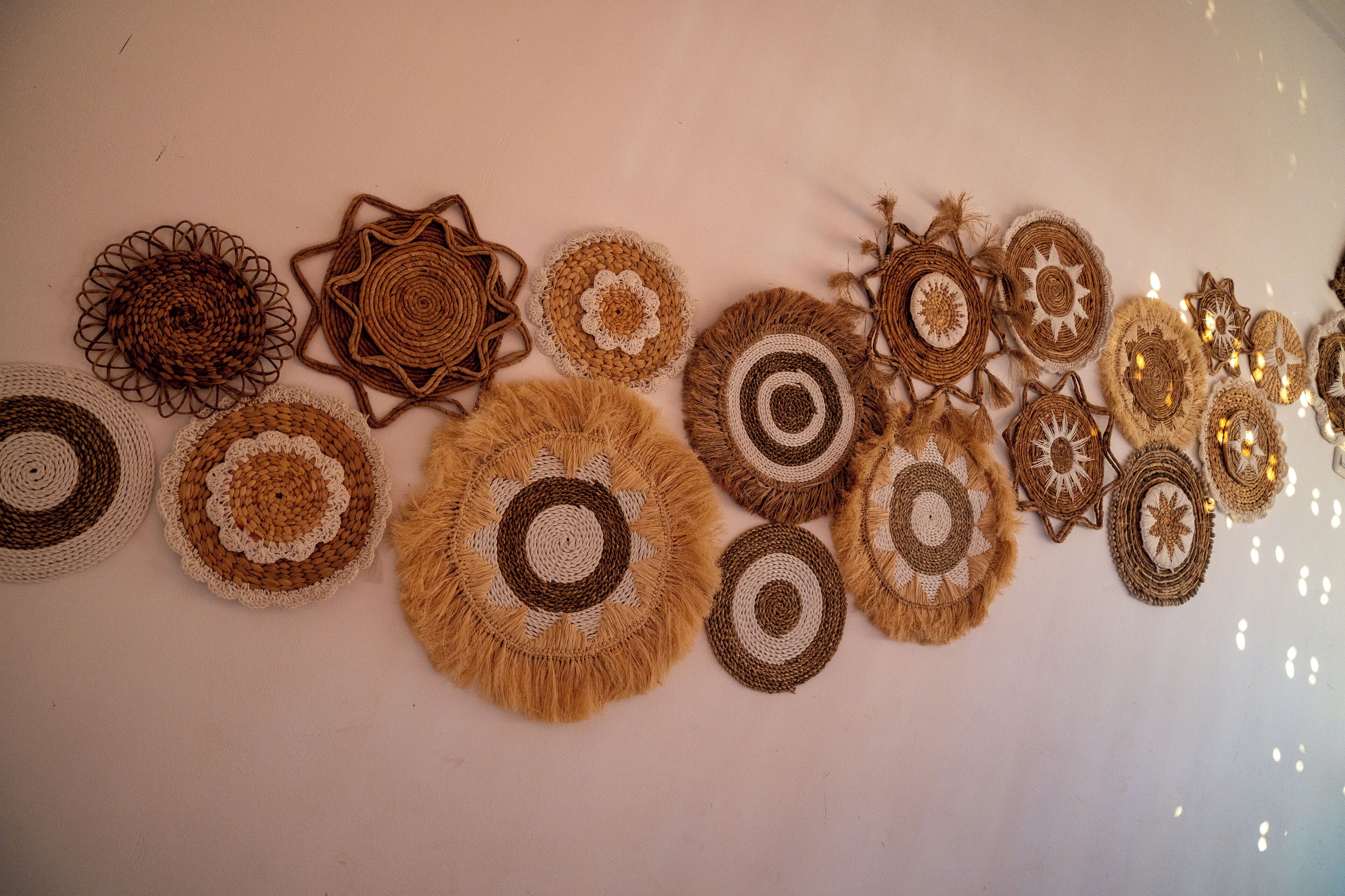 A collection of variously sized and shaped crocheted items arranged on a flat surface.