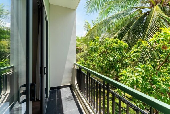 Deluxe Triple Room, Garden View | Balcony