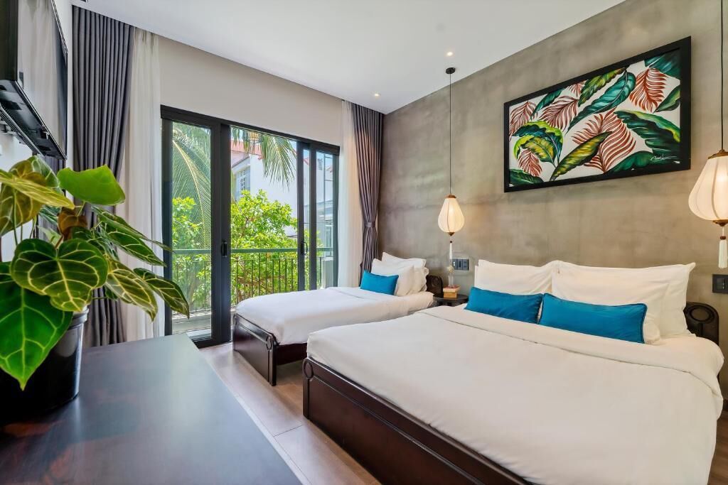 Deluxe Triple Room, Garden View | Minibar, desk, soundproofing, free WiFi