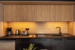 Fridge, coffee/tea maker, toaster, cookware/dishes/utensils