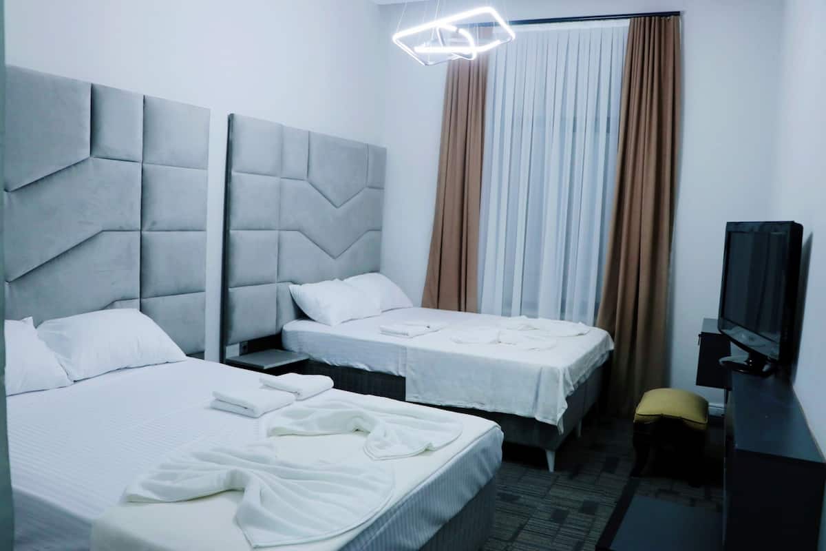 Classic Quadruple Room, 2 Queen Beds | Premium bedding, down comforters, minibar, individually decorated