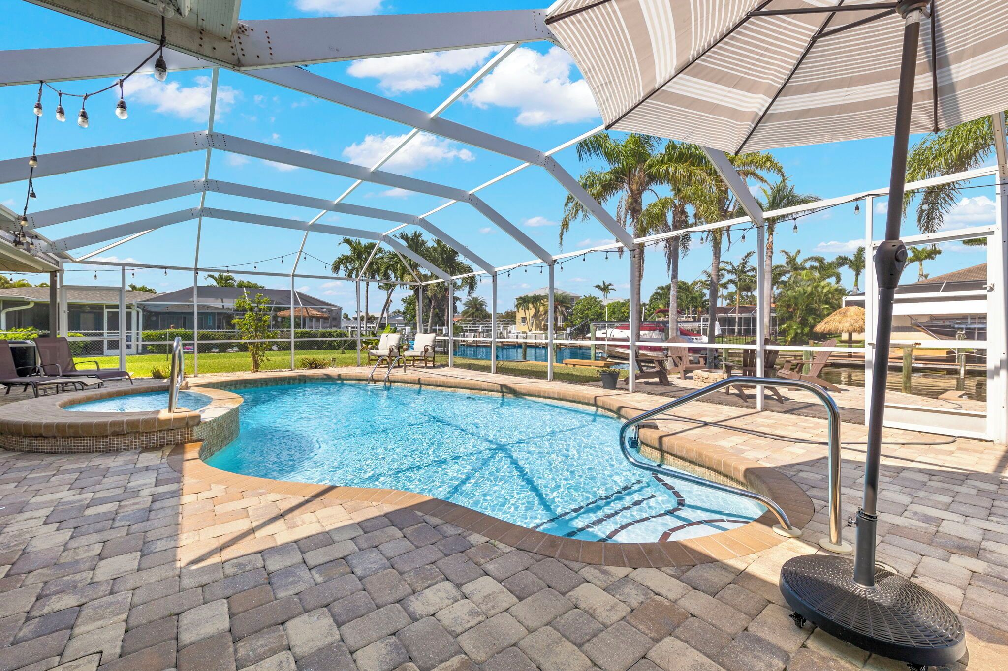 Latitude Adjustment | Canal-Front + Screened-In Pool & Patio