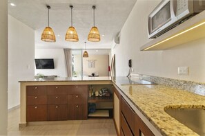 Fridge, microwave, stovetop, coffee/tea maker